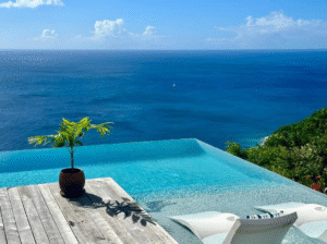Infinity pool with an ocean view at a luxury tropical villa